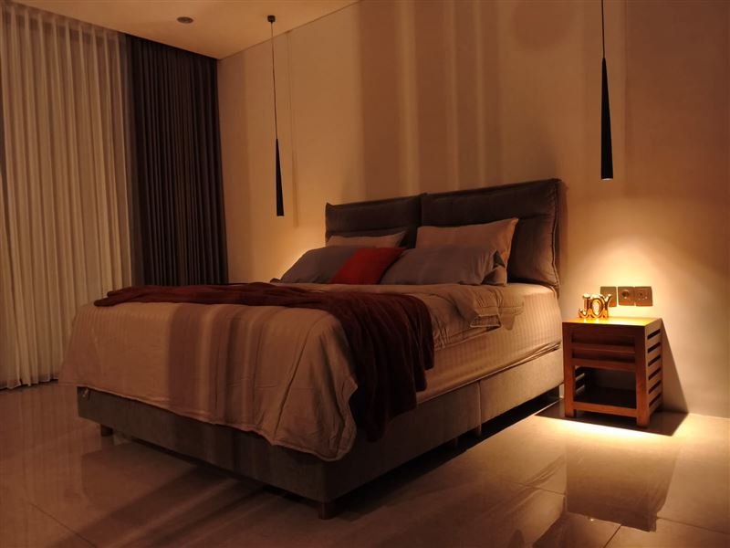 Master bedroom with warm evening lighting