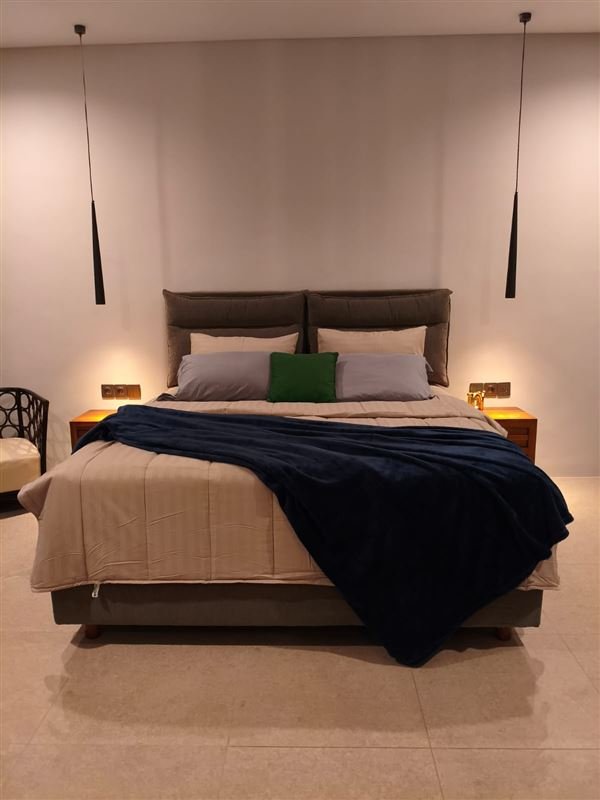 Bedroom with bedside lighting